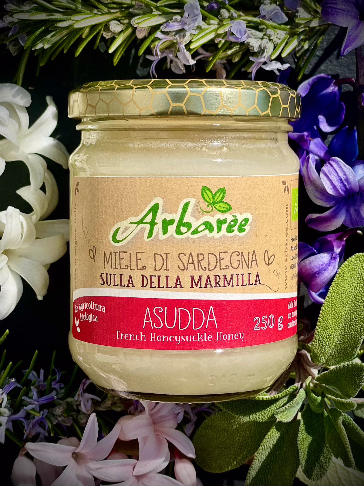 Glas Sulla-Honig mit floralem Hintergrund