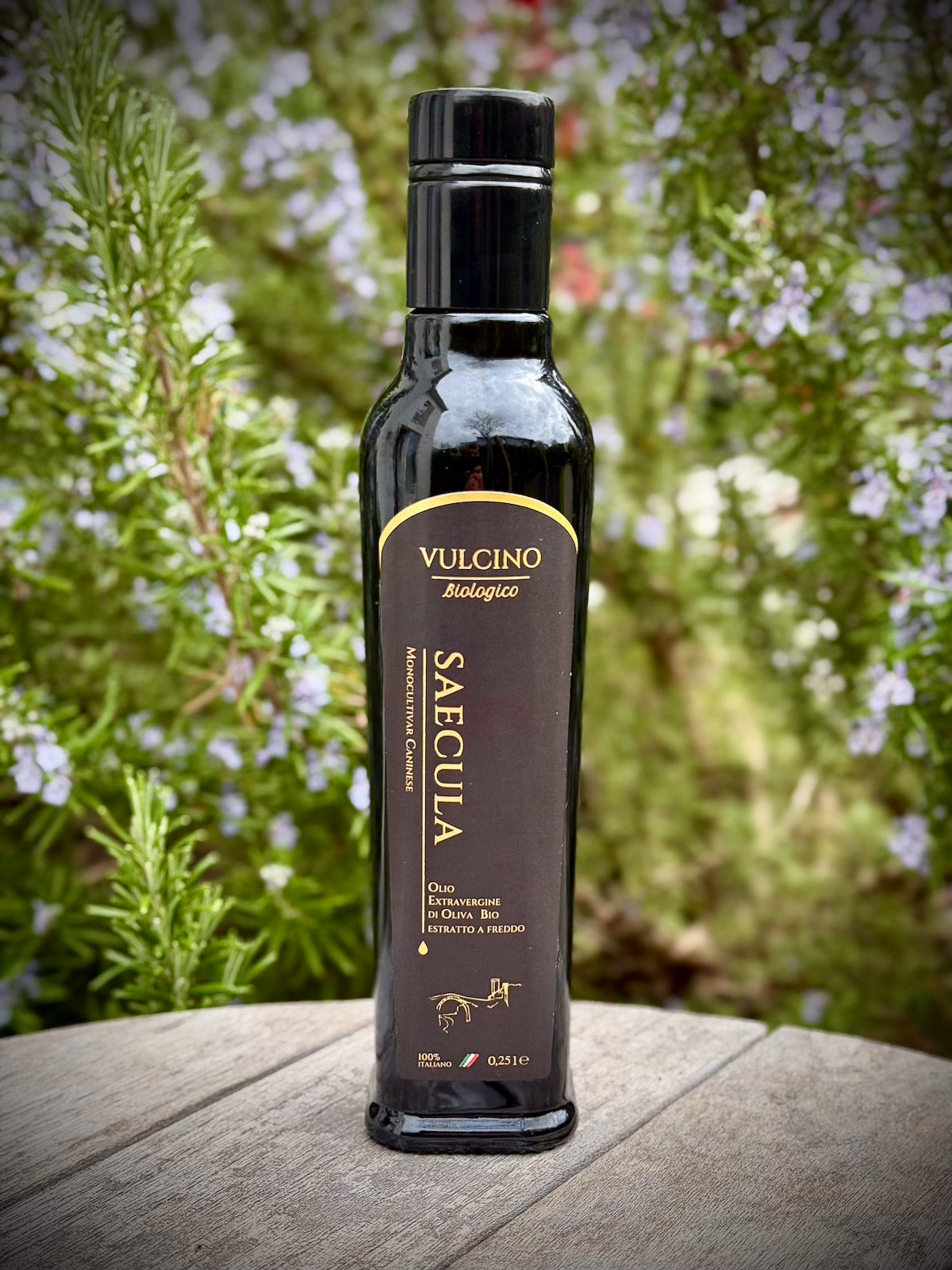 Vulcino olive oil bottle on a wooden surface with a natural background