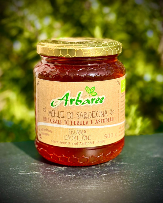 Jar of Arbaree honey with a green background