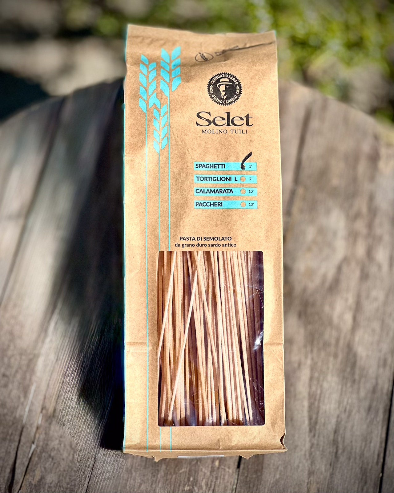 Pack of spaghetti on a wooden table background