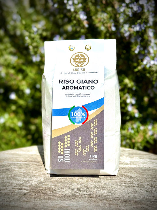 Bag of Riso Giano Aromatic rice on a wooden surface with a blurred green background