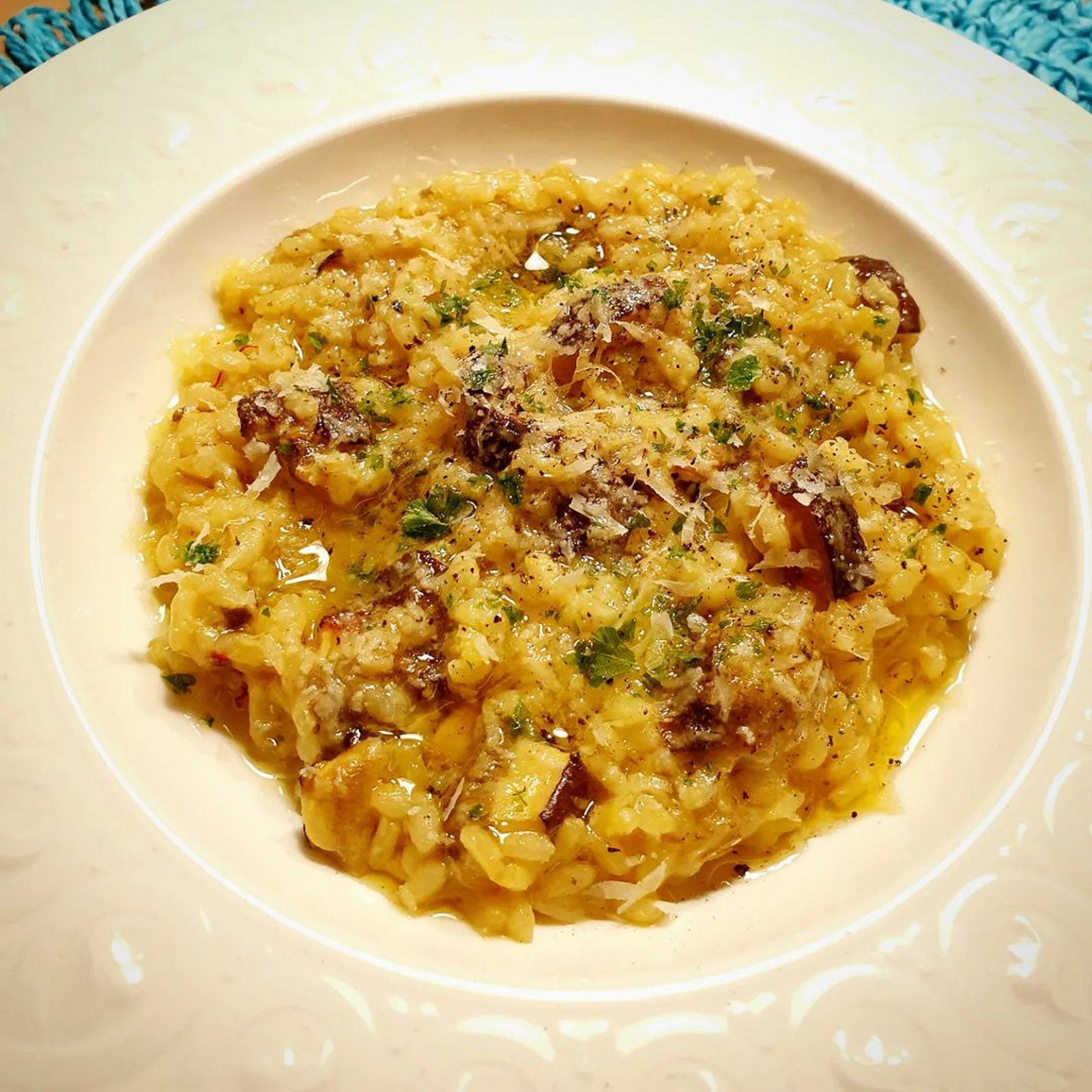Risotto with mushrooms on a white plate