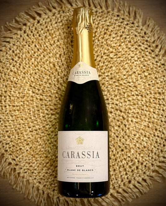 Bottle of Carassia blanc de blancs sparkling on a textured woven surface