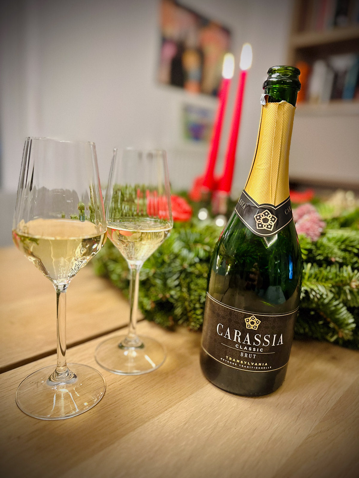 Bottle of Carassia wine with two glasses on a table with a festive background