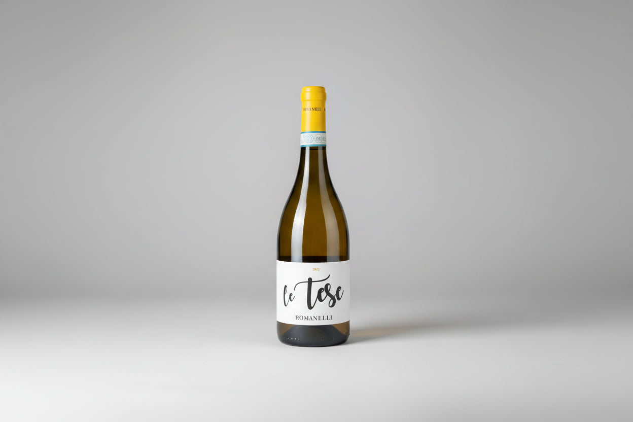 A bottle of wine "Le Tese" from Romanelli on a grey background
