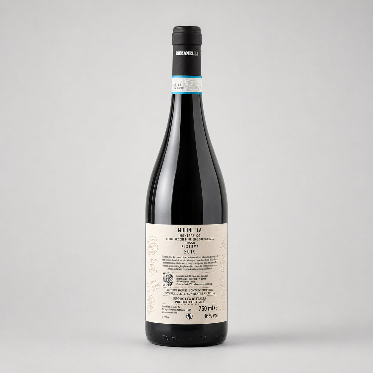 Backside of a wine bottle Molinetta of type Montefalco from the producer Romanelli with label on a gray background
