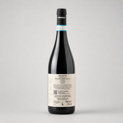 Backside of a wine bottle Molinetta of type Montefalco from the producer Romanelli with label on a gray background