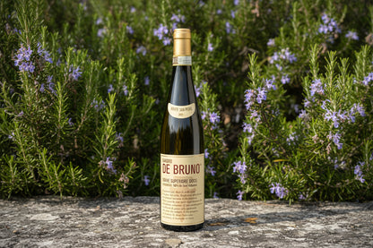 Sandro de Bruno Soave wine bottle with blooming rosemary in the background